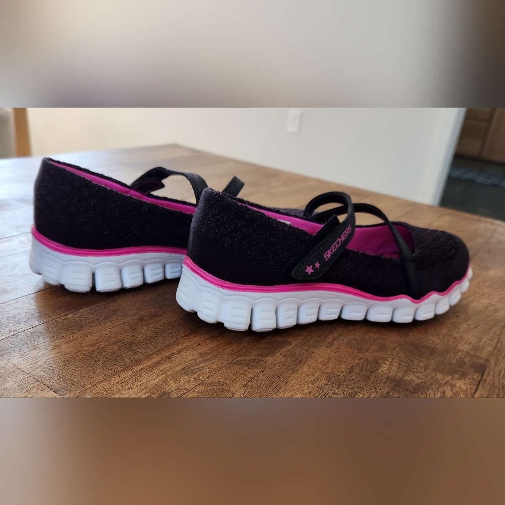Size 4 children's Skechers. Velcro fasteners.  Barely worn